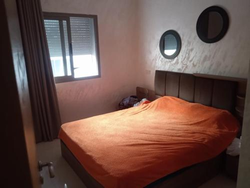 Ένα ή περισσότερα κρεβάτια σε δωμάτιο στο Appartement avec piscine