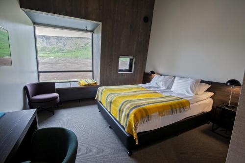 Postel nebo postele na pokoji v ubytování Fosshotel Glacier Lagoon