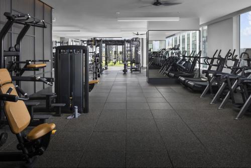 a gym with a lot of treadmills and machines at The Lilas-Ocean view Stay high floor Pool Parking in Los Angeles
