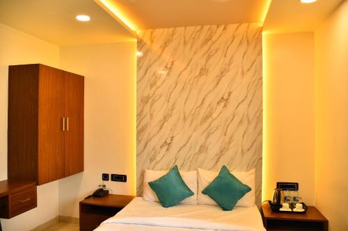 Ein Bett oder Betten in einem Zimmer der Unterkunft Sree Mahalakshmi Residency