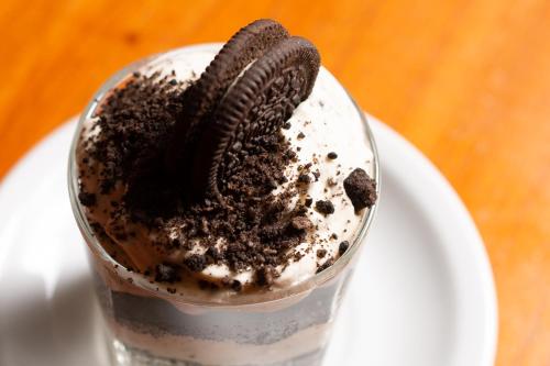 a cookie oreo milkshake in a glass on a plate at Rancho Grande Hostel in El Chalten