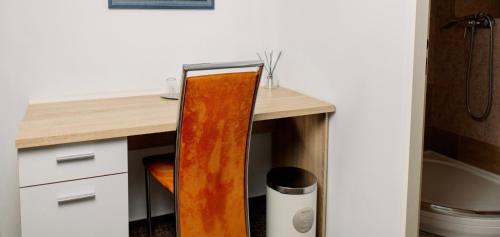 a kitchen with a wooden desk with a mirror at M-Tourist in Prague