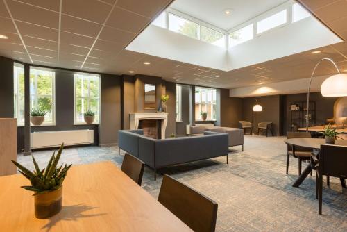 Χώρος καθιστικού στο NH Eindhoven Conference Centre Koningshof