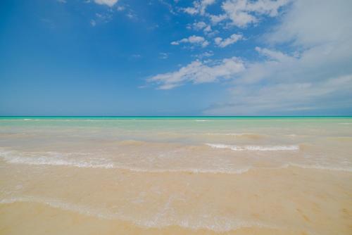 a view of the ocean from the beach at Arena y Mar Seaside Glamping - Adults Only by The Spot Rentals in El Cuyo