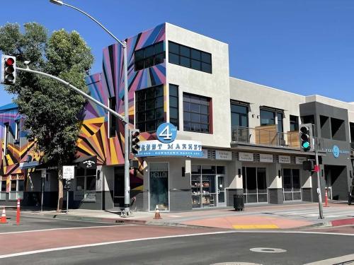 a building on the corner of a street with a traffic light at Premium Stay 10 Min From Disneyland With Pool & GYM in Tustin