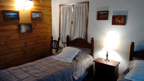 A bed or beds in a room at Alamos del Sur