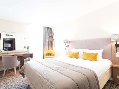 Ένα ή περισσότερα κρεβάτια σε δωμάτιο στο Mercure Lublin Centrum