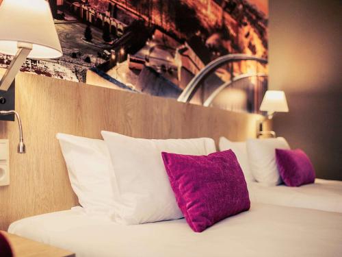 Ένα ή περισσότερα κρεβάτια σε δωμάτιο στο Mercure Lublin Centrum