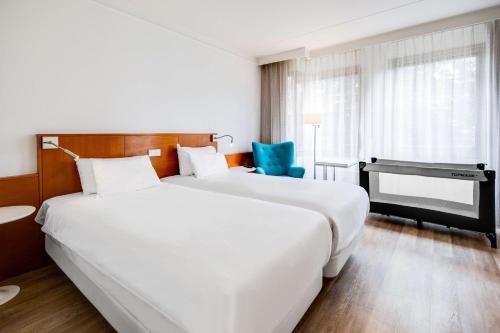 Una cama o camas en una habitación de NH Bussum Jan Tabak