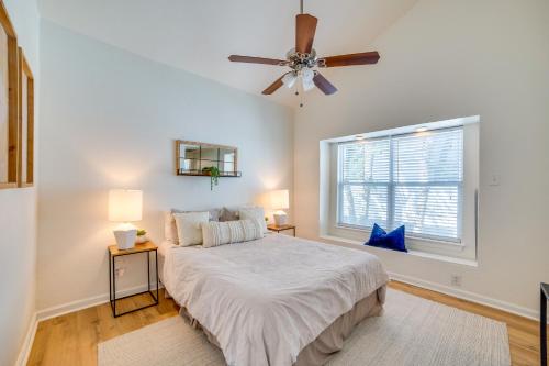 a bedroom with a bed and a ceiling fan at 3 Mi to Downtown Dallas Sleek Condo with Patio in Highland Park
