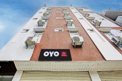 a building with a sign on the side of it at Hotel O Shiridi Residency in Vidya Nagar