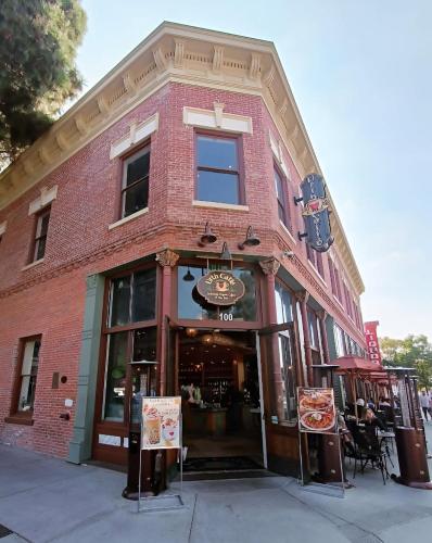 a red brick building with a pizza restaurant at Sunlit Retreat 10 Min from Disneyland With Pool & GYM in Tustin