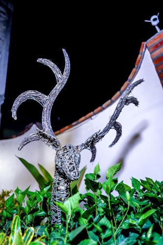 a metal statue of a reindeer with large horns at Bungalows Maria Teresa in Rincon de Guayabitos