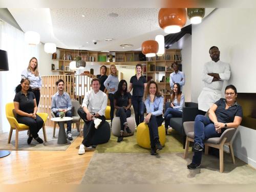 a group of people sitting in a waiting room at Mercure Nantes Centre Gare in Nantes