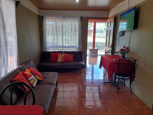 a living room with a couch and a table at Quinta El Futuro in Esperanza