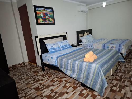 Postel nebo postele na pokoji v ubytování Hostal los Faroles