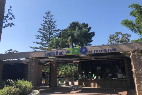a building with a sign on top of it at Luxury Haven 10 Min From Disneyland With Pool & GYM in Tustin