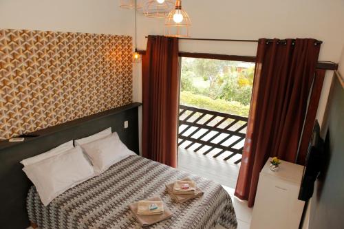 Postel nebo postele na pokoji v ubytování Pousada Kauai