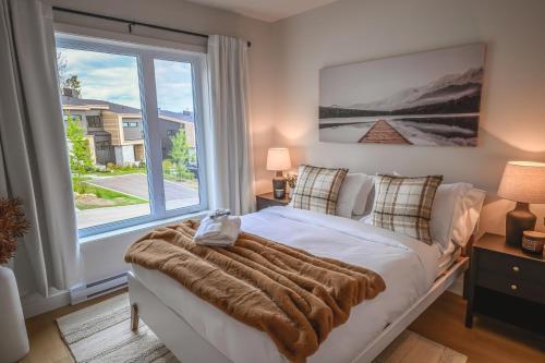 Ένα ή περισσότερα κρεβάτια σε δωμάτιο στο Luxe Alpine MSA - Ski Spa et Confort