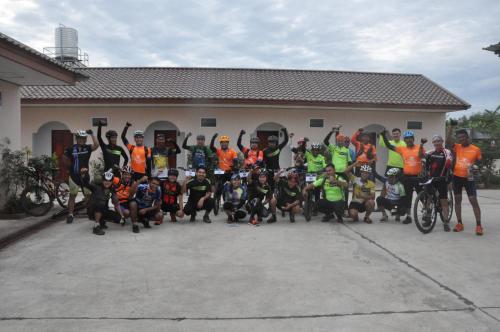 a group of people posing for a picture in front of a house at Banana Resort Sadao in Sadao