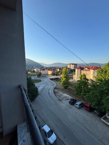 a view of a street with cars parked on the road at Modern stylish apartment in Kičevo