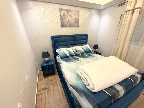 Postel nebo postele na pokoji v ubytování Luxurious 2 bedroom apartment at the heart of Accra