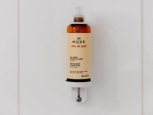 a bottle of nuke hanging on a wall at Mercure Nevers Pont De Loire in Nevers