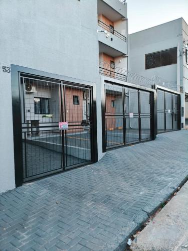 a row of gates on the side of a building at Xavi Studio in Bauru