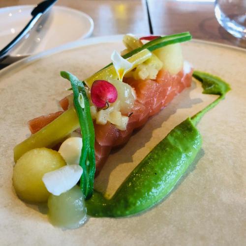 a plate of food with meat and vegetables on it at Charme logies Kampernoelie in Hoeselt