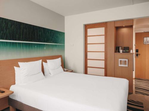Ένα ή περισσότερα κρεβάτια σε δωμάτιο στο Novotel Paris Centre Tour Eiffel