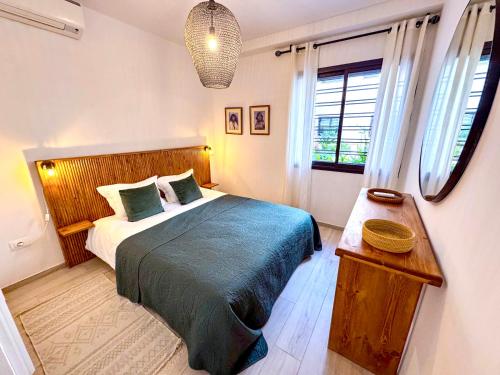 Ένα ή περισσότερα κρεβάτια σε δωμάτιο στο Cocon douceur