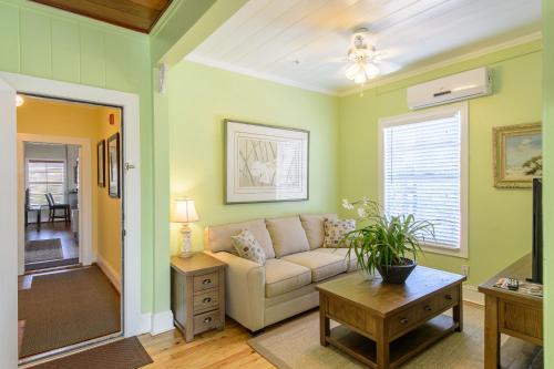 a living room with a couch and a table at Old Colorado Inn in Stuart