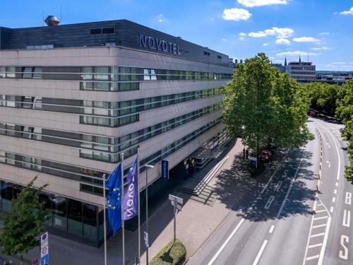 a building with a sign on the side of it at Novotel Aachen City in Aachen