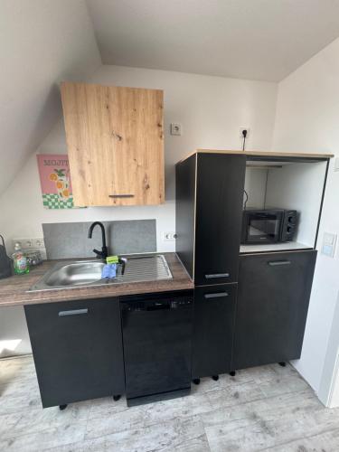 Η κουζίνα ή μικρή κουζίνα στο CLUBHAUS 6 - Dachwohnung mit 2 Schlafzimmern, Balkon & Netflix