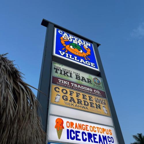 a sign for a ice cream shop with signs on it at Entire Siesta Key Beach House - 6 BR, Pool & Ocean Access in Siesta Key