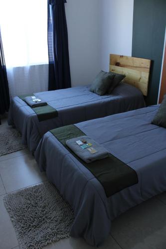 Ένα ή περισσότερα κρεβάτια σε δωμάτιο στο Habitaciones en Casa Casiopea