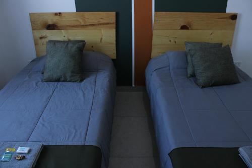 Ένα ή περισσότερα κρεβάτια σε δωμάτιο στο Habitaciones en Casa Casiopea