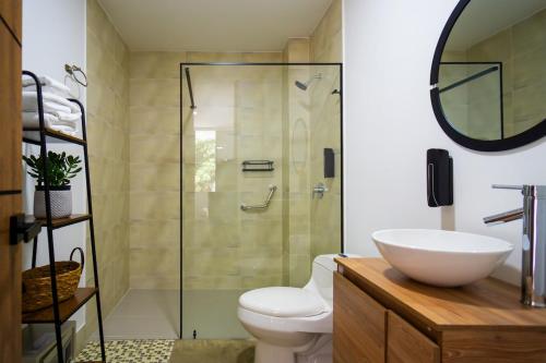 a bathroom with a shower and a toilet and a sink at Norte cali -Bosque Living -204 in Cali