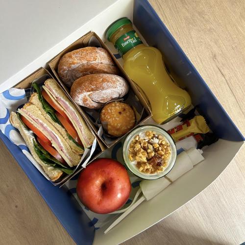a lunch box filled with different types of food at Bext Valdebebas in Madrid