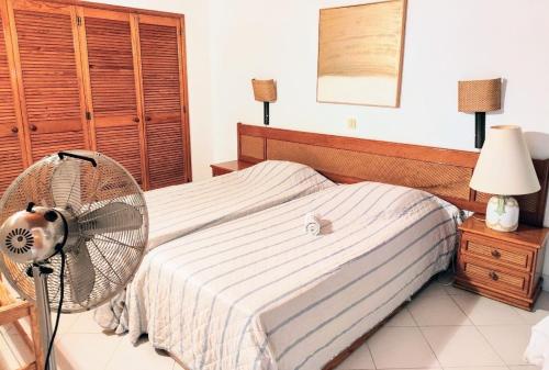 Ένα ή περισσότερα κρεβάτια σε δωμάτιο στο Ocean view Cerro Branco with pool