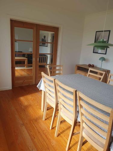 a dining room with a table and chairs and a table and chairsktop at Lovely Holiday Home With Views Of Fields in Lebøl
