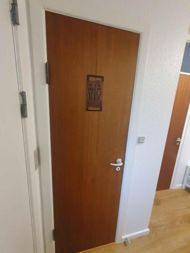a wooden door with a picture on it in a room at Lovely Holiday Home With Views Of Fields in Lebøl