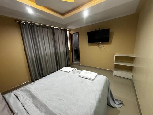 Кровать или кровати в номере Hotel inti killa chaska
