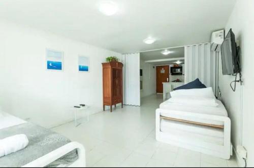 Ένα ή περισσότερα κρεβάτια σε δωμάτιο στο Apartamentos con piscina 1 cuadra de la playa