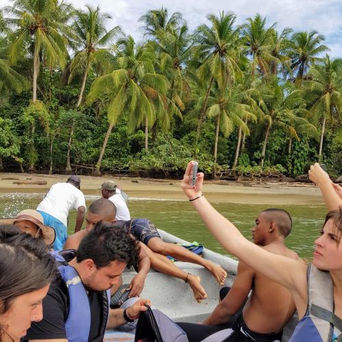 a group of people on a boat in the water at SURF HOUSE ESTILO LIBRE in Buenaventura