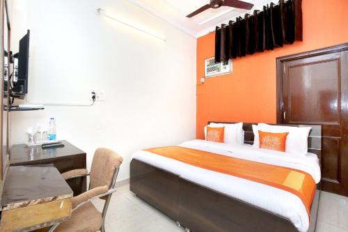 Una televisión o centro de entretenimiento en Hotel O Amar Inn