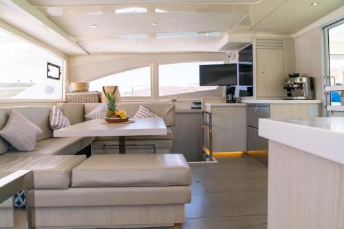 a kitchen and living room of a recreational vehicle at Leopard 51' in La Paz