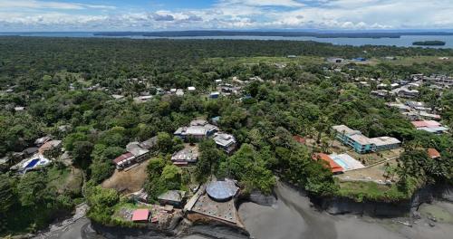 an aerial view of a resort in the middle of a forest at SURF HOUSE ESTILO LIBRE in Buenaventura