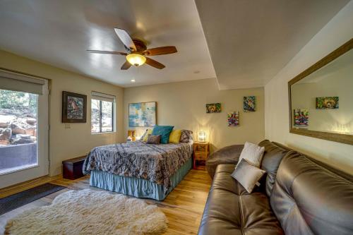 a bedroom with a bed and a couch and a ceiling fan at Mtn-View Deck at Home 7 Mi to Tonto Natural Bridge in Pine