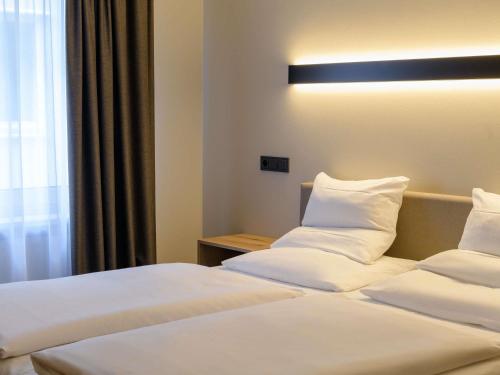 Katil atau katil-katil dalam bilik di Mercure Hotel München Altstadt